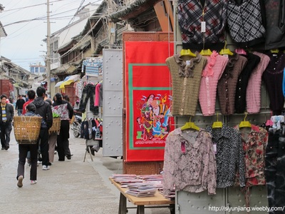 A busy street market selling clothes